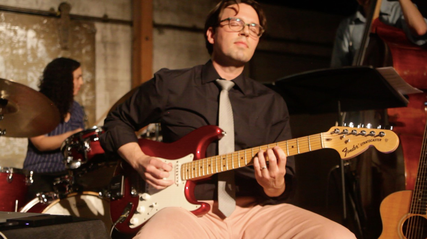 Matt Dievendorf performing Beyond the Horizon at Art Share L.A. with red stratocaster