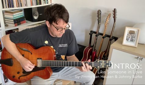 Matt playing his Sadowsky in his living room next to the bookshelf on a sunny morning