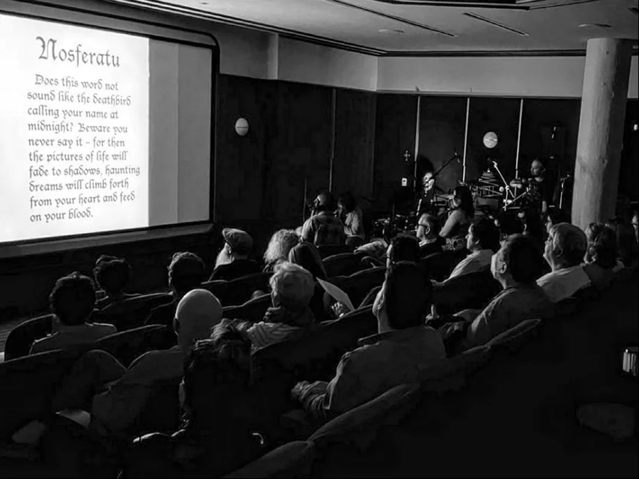 Black and white photo of the audience watching Nosferatu as the band performs the live improvised score